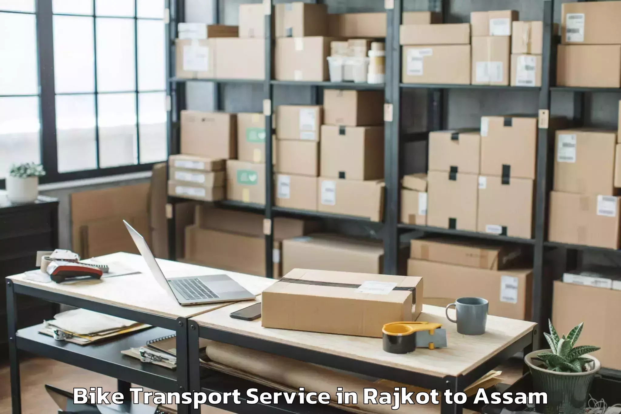 Book Rajkot to Behali Bike Transport Online